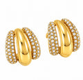 Gold triple row pave cz huggie hoop earrings chunky statement jewelry on white background.