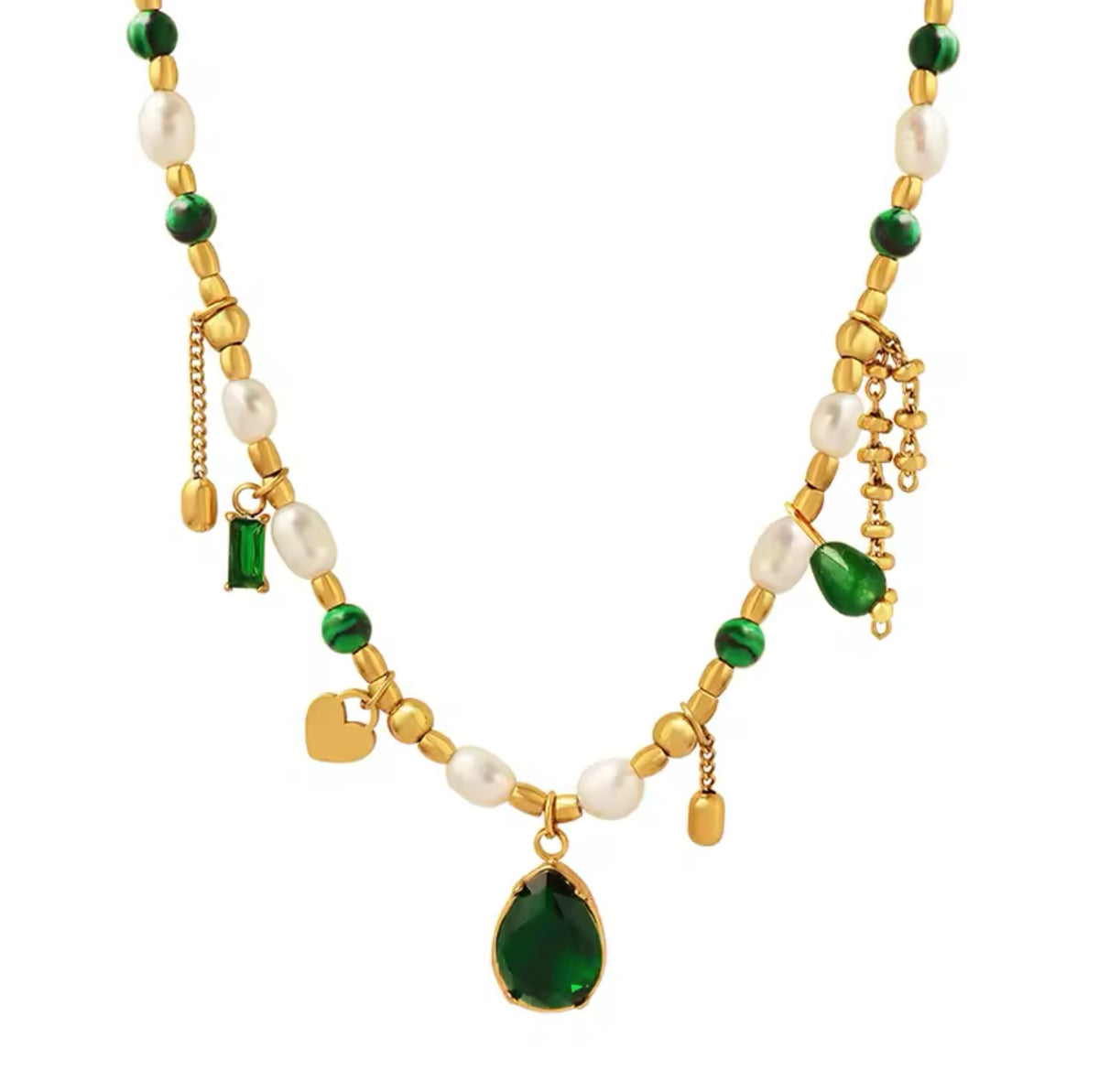A beaded charm necklace featuring alternating white freshwater pearls, round green beads, and gold spacer beads, set against a light background. Suspended along the strand are several gold charms and gemstones, including a large teardrop-shaped emerald-green pendant at the center, a small gold heart charm, a rectangular green gemstone charm, and delicate dangling chain accents.