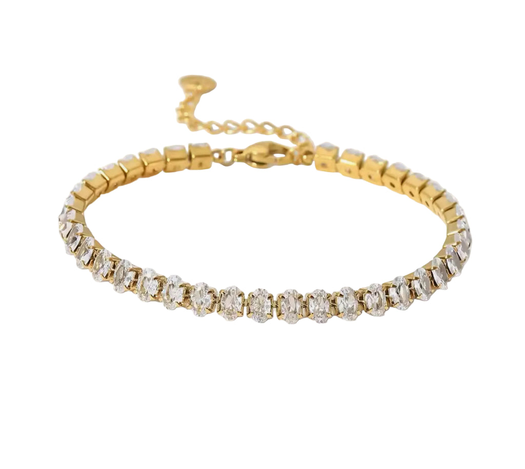Gold cz tennis bracelet adjustable sparkle crystal wristband jewelry on white background.