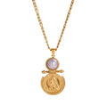 A gold pendant necklace featuring a round white pearl and an antique gold coin pendant, displayed on a clean white background with a subtle reflection.