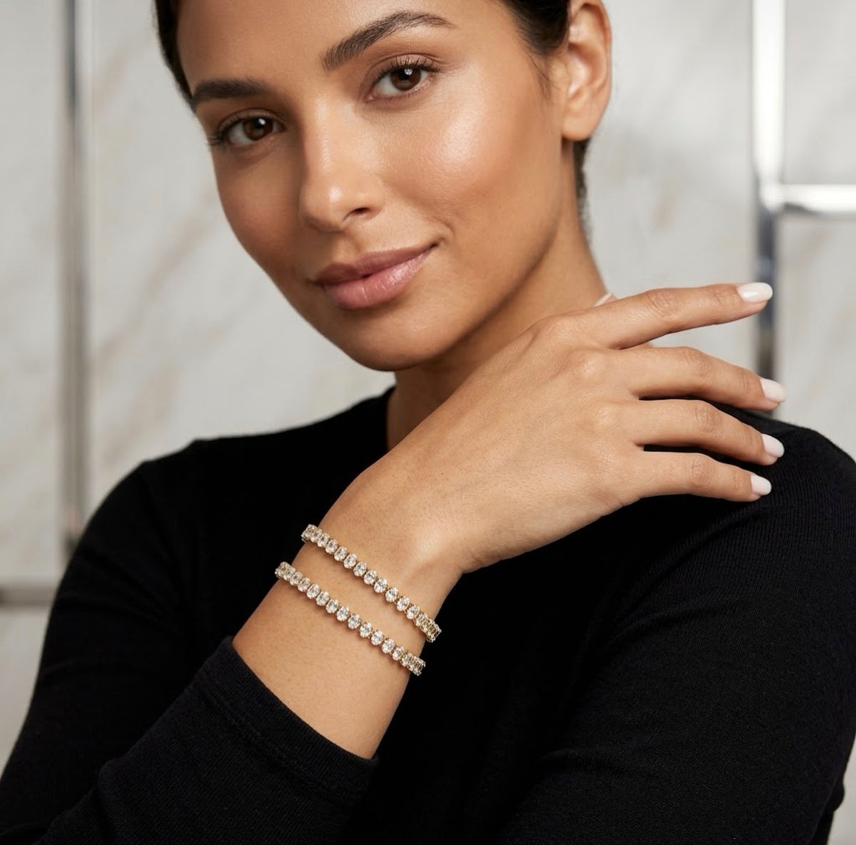 Model wearing stacked gold cz tennis bracelets elegant women jewelry lifestyle showcase.